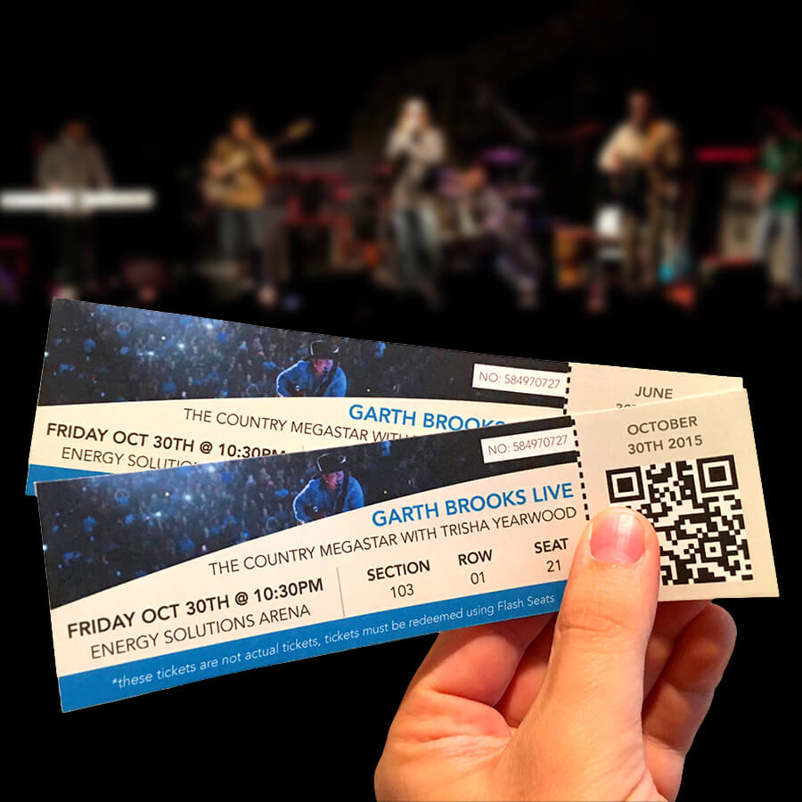 Concert tickets in front of a live concert stage